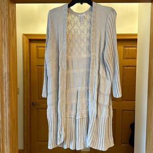 Chicos very soft sweater. There is ribbing, lace and plain knitting. Very soft